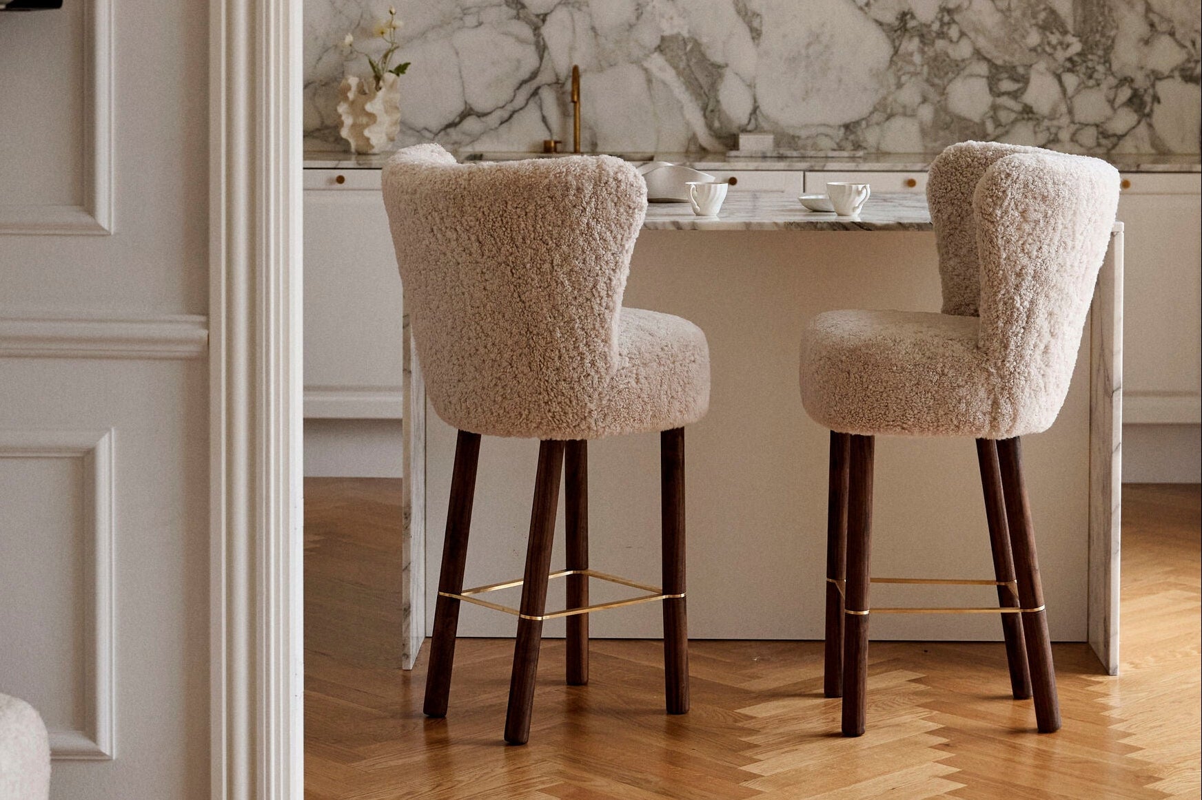 Sheepskin bar stools in a marble kitchen - Birthday Sale, 11 years, up to 60% off at Sheepskinhouse.com