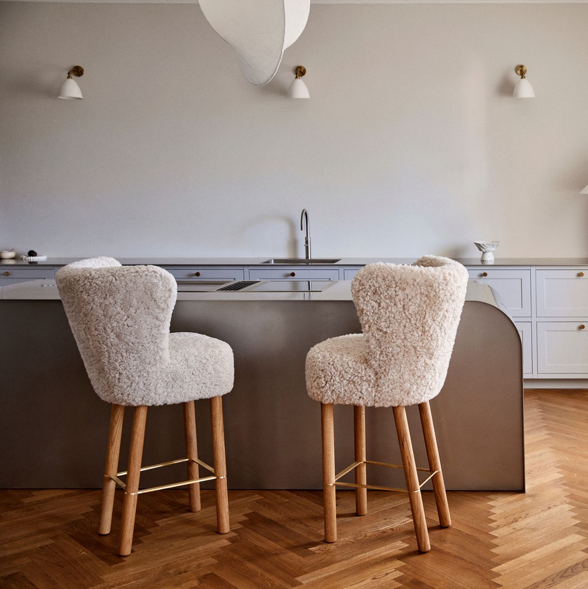 Two shearling bar stools at a kitchen island