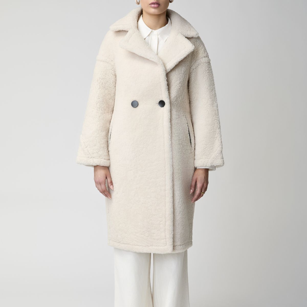 Model wearing the Savannah shearling coat in beige