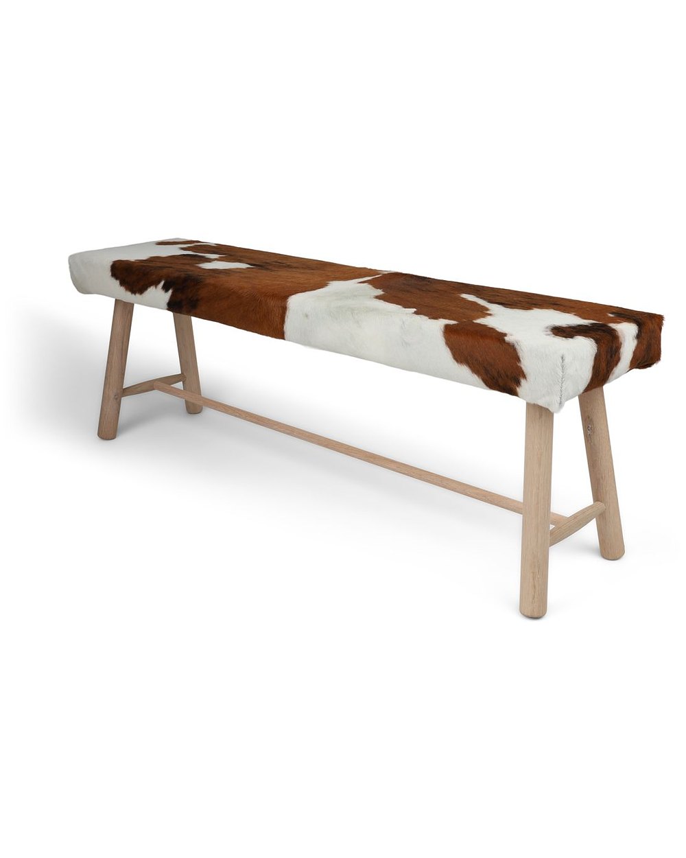 Cowhide bench in brown and white on oak legs