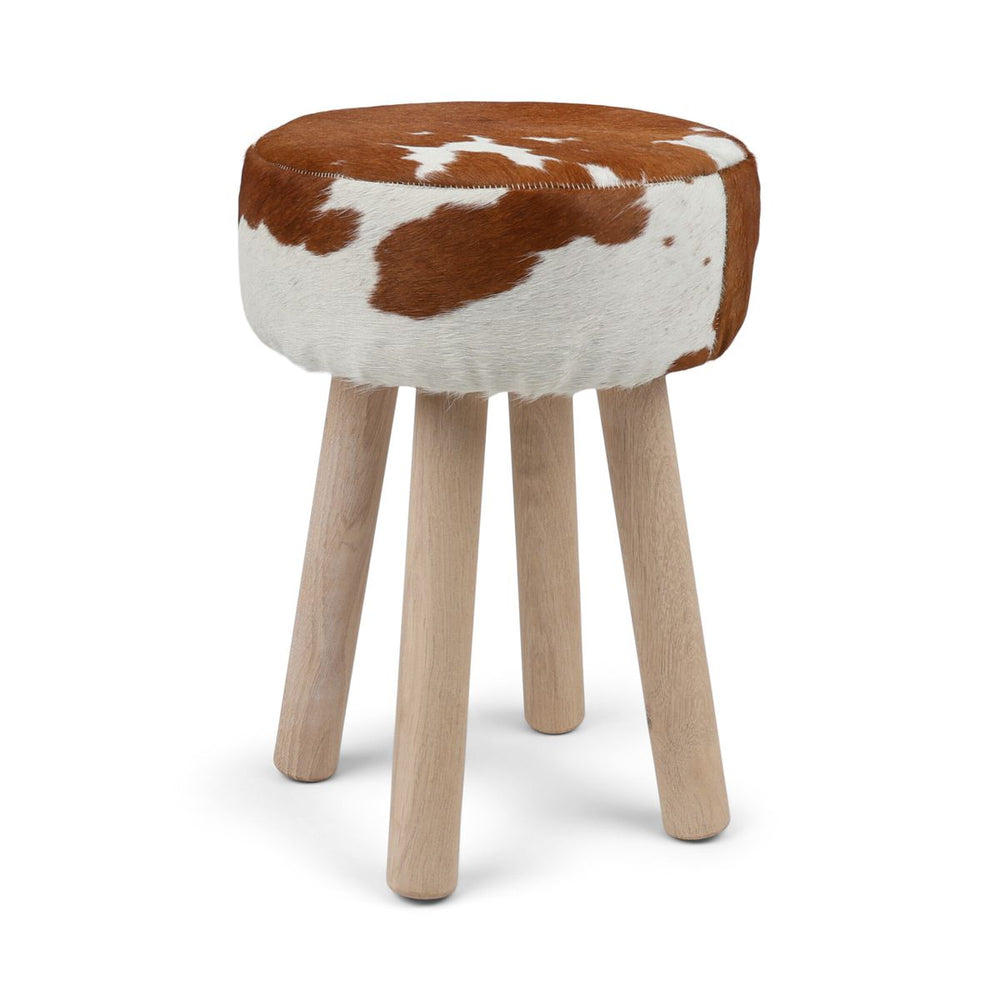 Cowhide stool in brown and white on wooden legs